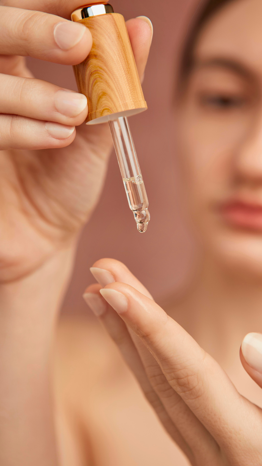 Close Up Of A Woman With Face Serum